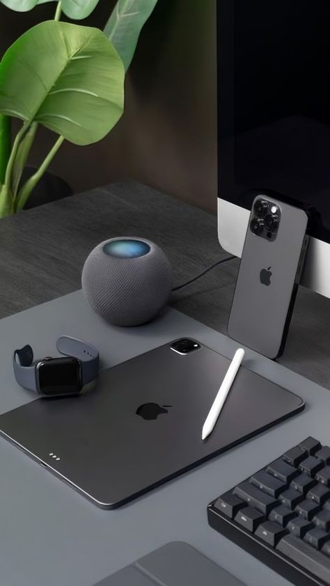 an apple computer and other electronics on a desk