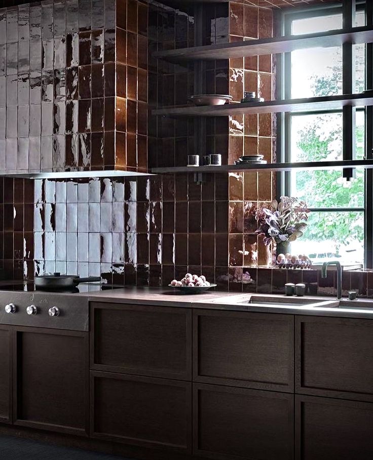 a kitchen with wooden cabinets and tile backsplash