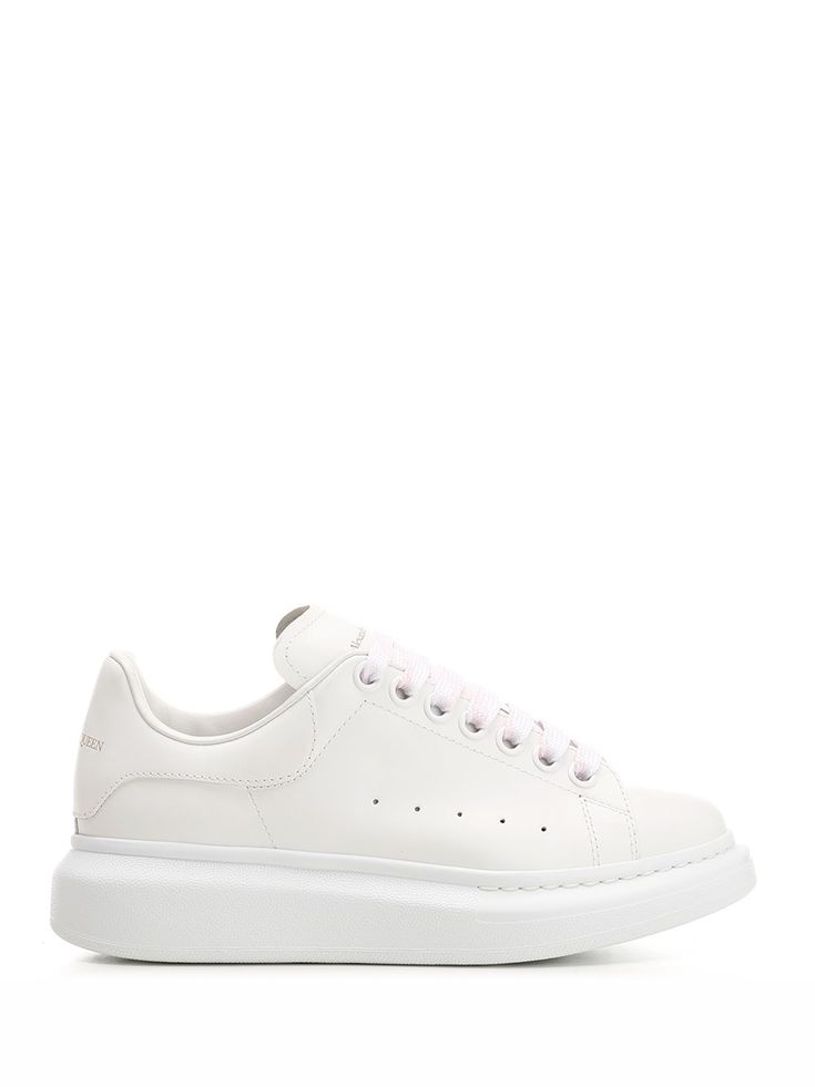 Total white "Oversize" sneakers in smooth leather with high sole and embossed logo on the heel from Alexander McQueen. White Calf Leather Sneakers For Streetwear, White Platform Sneakers With Embossed Logo And Round Toe, White Round Toe Platform Sneakers With Embossed Logo, White Leather Platform Sneakers With Embossed Logo, Classic Platform Sneakers With Embossed Logo For Streetwear, White Calf Leather High-top Sneakers For Streetwear, White Platform Sneakers With Calf Leather And Rubber Sole, White Calf Leather Platform Sneakers With Rubber Sole, White Low-top Calf Leather Platform Sneakers