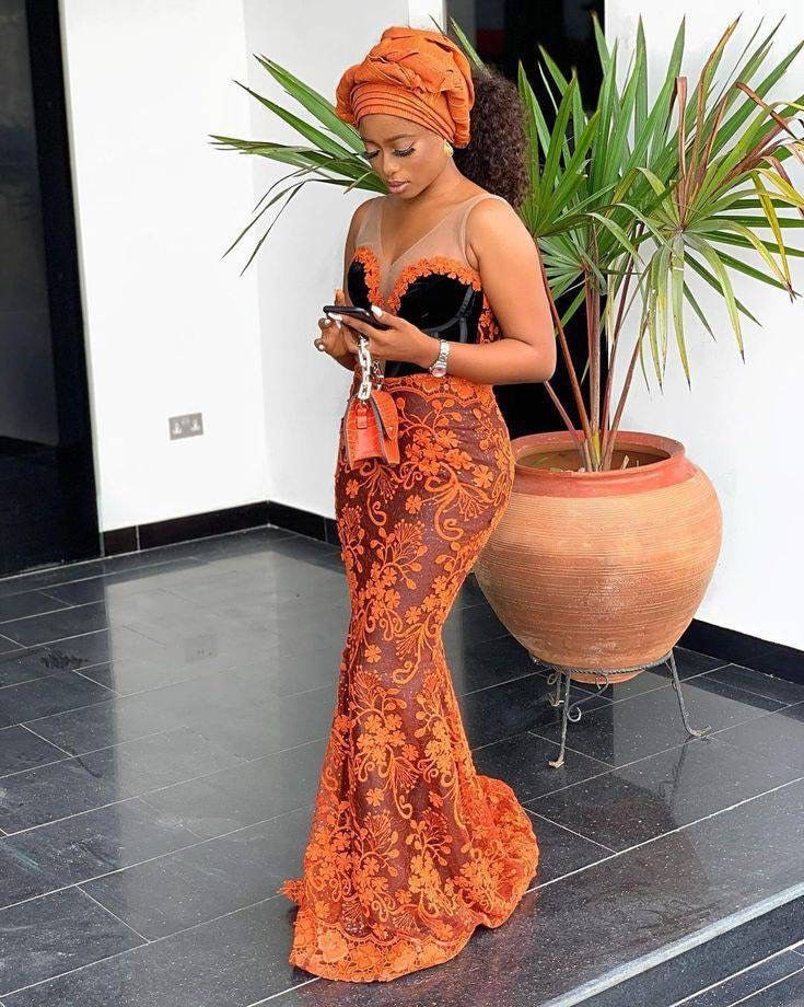 Long dress Sizing: each sizing is a custom made to your personal measurements. Kindly leave a note of your measurements when checking out.  Fabric of choice will be chosen Ghana Clothing, Burnt Orange Lace Dress, Latest Lace Styles, Lace Styles For Wedding, Nigerian Lace Dress, Ankara Outfits, Aso Ebi Lace Styles, Orange Lace Dress, African Party Dresses