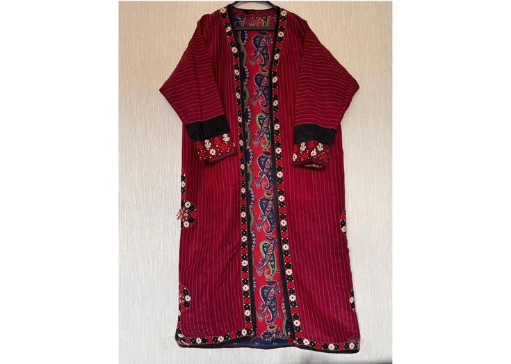 Add a unique and exotic touch to your wardrobe with this antique Turkmen silk kaftan, also known as a kimono or chapan. This original piece from the 1960s is a great addition to any collection. It is made from hand-woven silk and cotton fabrics used as lining. All embroidery is in silk. Used. Showcasing vibrant and colorful Turkmen regional design. The multicolored silk material adds a luxurious touch to the piece. Perfect for cultural events, this Turkmen traditional garment is a must-have for Traditional Red Kaftan Straight Kurta, Red Embroidered Silk Kaftan, Traditional Silk Tunic Kaftan, Traditional Tunic Abaya With Floral Embroidery, Traditional Silk Kaftan With Resham Embroidery, Transitional Traditional Straight Kurta Kaftan, Red Long Sleeve Kaftan With Traditional Patterns, Bohemian Kaftan With Embroidered Border, Traditional Embroidered Tunic Abaya