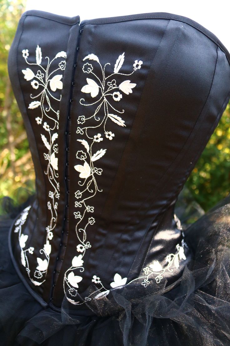 BLACK WEDDING GOWN Handmade wedding dress corset bustier, bridal skirt top. Alternative- hand embellished. AND Ruffled tulle skirt! Custom so some changes are available! Several different custom corsets available with waist length or drop waist More pics on fb: https://www.facebook.com/media/set?vanity=RetroVintageWeddings1920s1930s&set=a.3290421437720543 Also do styles in ivory https://www.facebook.com/media/set/?vanity=RetroVintageWeddings1920s1930s&set=a.3216239945138693 Wedding Dress Alternative, Custom Corsets, Bridal Skirt, Black Wedding Gowns, Halter Wedding, Victorian Vampire, Dress Alternative, Handmade Wedding Dresses, Steampunk Victorian