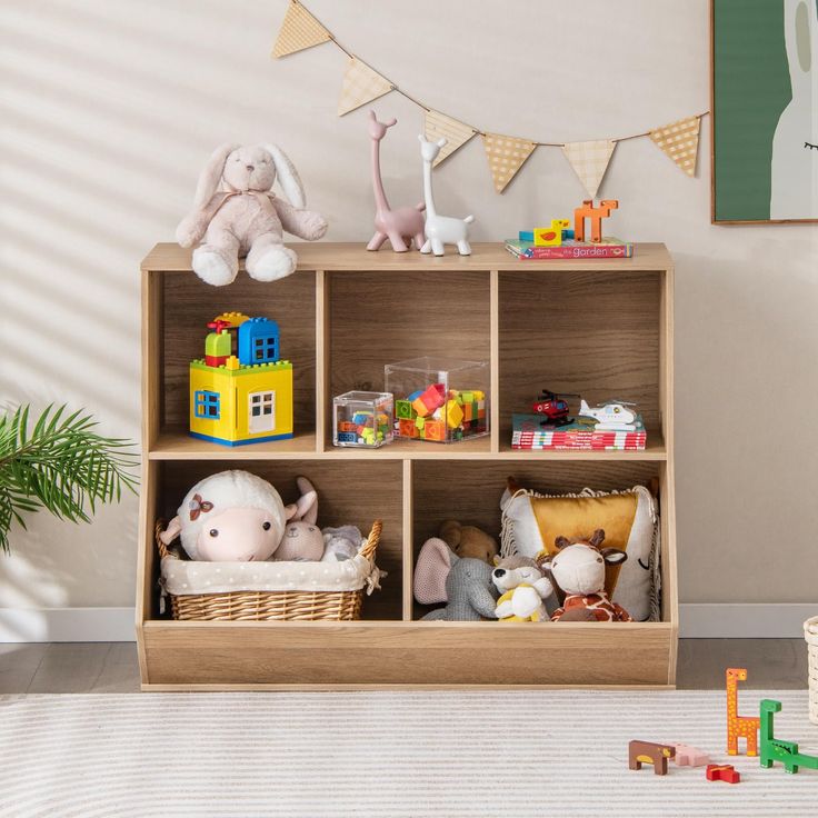 a toy shelf with stuffed animals and toys on it in a child's room