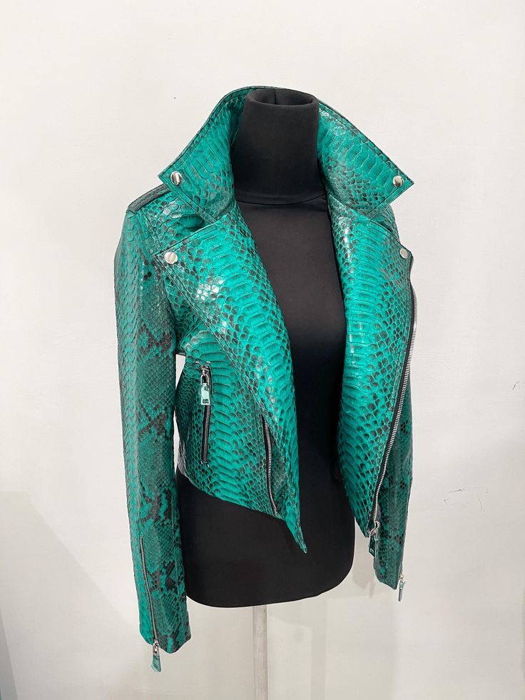 Woman's SNAKESKIN Jacket All our products are 100% handmade, we always try to create interesting ideas to make your style unique. We use only the highest quality materials and accessories from around the world and only best leather from Indonesia. Before listing each new model undergoes different quality and usability tests at every stage of production. Every single piece is made by hand, by a highly-skilled specialist. You can choose any color from more than 100 colors in our collection. Please Designer Fitted Biker Jacket For Events, Green Long Sleeve Biker Jacket, Green Moto Leather Jacket With Long Sleeves, Green Fitted Biker Jacket, Fitted Green Moto Biker Jacket, Fitted Green Biker Jacket, Fitted Moto Biker Jacket In Green, Snakeskin Jacket, Green Python