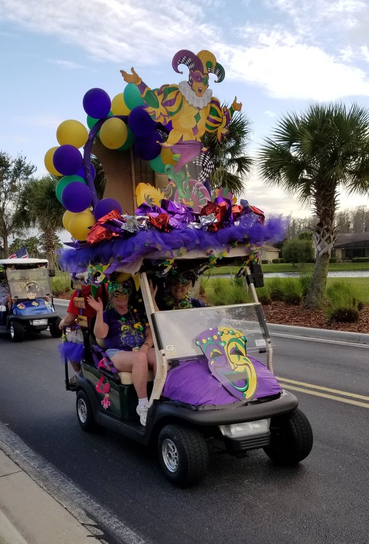 a golf cart decorated with balloons and decorations