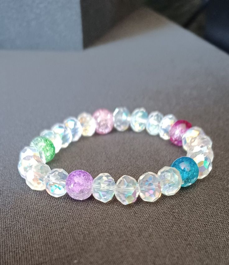 💕 Made with durable, pre-stretched crystal elastic for a perfect fit. 💕 Made with 8mm crystal rondelle beads and colorful 8mm glass beads. 💕 Beautiful in the light. 💕 Slight color variations may occur due to flash used in photography and photo enlargement. 💕 Bracelet will be shipped within 1 to 3 days except holidays. 📬 💕 If you have any questions, please don't hesitate to contact me. I will do my best to reply as soon as possible. Gift Iridescent Beaded Bracelets With Faceted Beads, Iridescent Faceted Beaded Bracelets As Gift, Iridescent Faceted Beads Bracelet For Gift, Iridescent Faceted Beads Bracelet As Gift, Iridescent Bracelets With Faceted Beads As Gift, Iridescent Bracelet With Faceted Beads For Gift, Multicolor Spiritual Beaded Bracelets For Birthday, Spiritual Multicolor Beaded Bracelets For Birthday, Iridescent Beaded Bracelets With Colorful Beads As Gift