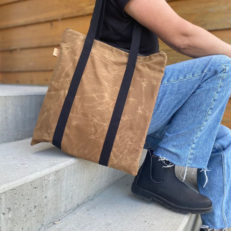 "This waxed canvas tote bag will hold a 13 inch laptop and a bunch more. Like all my bags, it is vegan. There's an exterior pocket that will fit your phone, and 3 interior slip pockets for all your essentials. The exterior is made of 13 oz waxed cotton canvas.  Waxed Canvas acts as a natural water repellent, so you'll love having it by your side rain or shine.  Waxed canvas has a worn and rustic appearance and texture.  It is normal for it to look like it has scratches and creases.  Bag Details Functional Everyday Waxed Canvas Bag, Eco-friendly Everyday Waxed Canvas Bag, Outdoor Canvas Tote Bag With Zipper Closure, Eco-friendly Waxed Canvas Travel Bag, Practical Duck Canvas Bag For Everyday Use, Duck Canvas Bag With Zipper Pocket For Everyday Use, Eco-friendly Waxed Canvas Tote Bag, Everyday Duck Canvas Bag With Zipper Pocket, Waxed Canvas Bag With Zipper Pocket For Daily Use