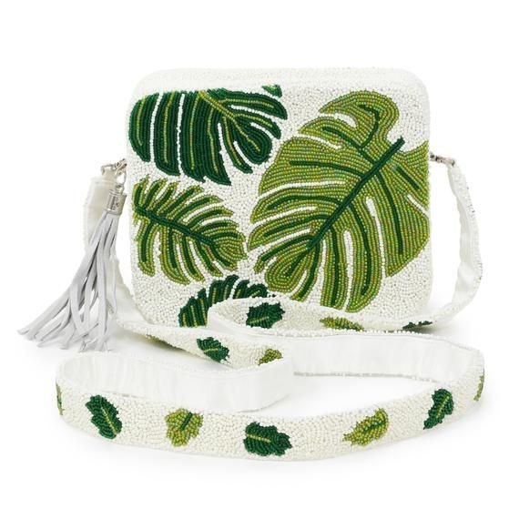 Paige Bag – Green LeafFully Beaded Crossbody Bag – customized with Green Monstera LeavesStructured silhouette measures 8 ″ wide x 6″ tall with 2″ gusset and is large enough to carry all sizes of the iPhone and other evening essentials.Satin-lined with a small pocket for credit cards and zippered closure.Fully Beaded Cross Body Length Strap with 24″ dropIn stock quantities are listed and will ship immediately.  Please allow four weeks for shipment of back ordered bags. Summer Beaded Pouch Bag, White Beaded Crossbody Bag, White Beaded Bags For Summer, White Beaded Summer Bags, Summer White Beaded Bags, Daily Use White Beaded Bags, Summer Crossbody Evening Bag, Beaded Shoulder Bag For Shopping, Green Beaded Rectangular Bag