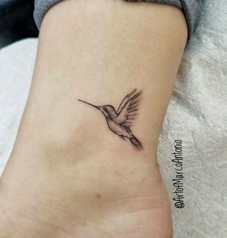 a small hummingbird tattoo on the ankle