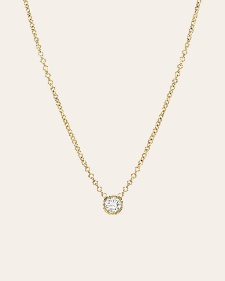 Beautifully handcrafted round cut 0.25ct. bezel diamond, hanging from a 14k solid gold dainty cable link chain with the length of your choice. Available in 14k yellow, white and rose gold. Size: Approx. 4mm Diamond Carat Weight: Approx. 0.25 ctw Clarity: VS Standard Production: 4-8 business days Rush Order Production: 2-5 business days Shipping: Select shipping method at checkout. 2-Day Shipping and Overnight shipping available by request at checkout Shipped from our L.A. Studio. Diamond Carat, Bezel Diamond, Necklace Sizes, Link Chain, Yellow White, Round Cut, Solid Gold, Diamond Necklace, Gold Color