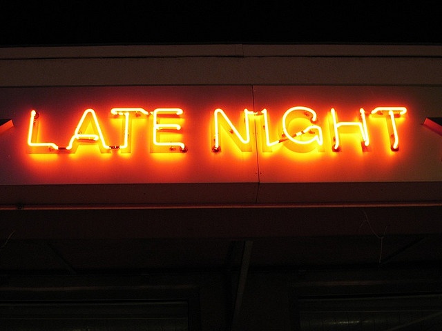 late night sign lit up in the dark