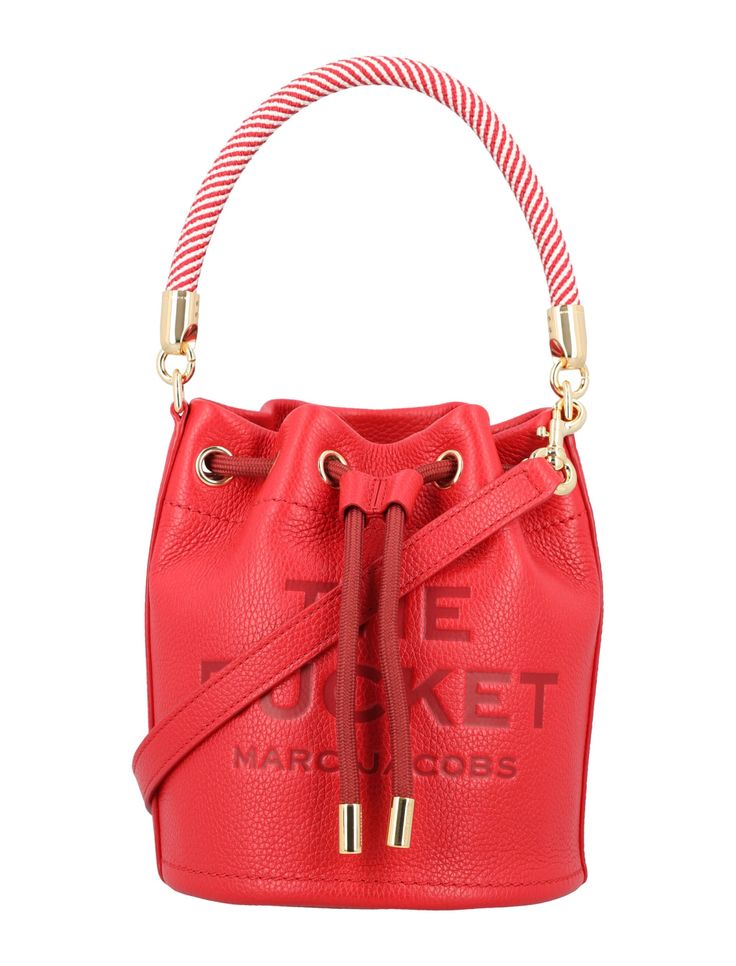 Grain Leather The Bucket Bag By Marc Jacobs. Featuring: Full Grain Leather Drawstring Pull Closure Rope Top Handle Removable And Adjustable Leather Strap Embossed Logo At Front One Interior Slip Pocket Contrast Color Leather Interior Height: 21cm Width: 18cm Depth: 18cm Composition: 100% cow leather | Marc Jacobs Women's The Bucket Bag in True Red | SS24 Leather Bucket Bag, Leather Bucket, True Red, Embossed Logo, Leather Interior, Luxury Retail, Bridal Shoes, Full Grain Leather, Luxury Boutique