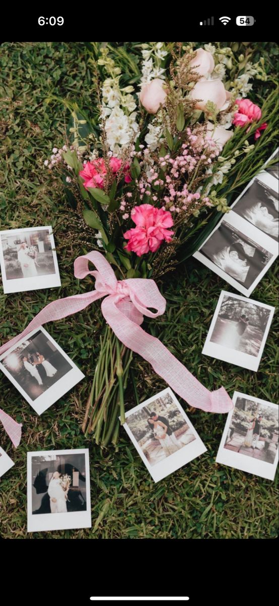 pink flowers and photos tied to the ground