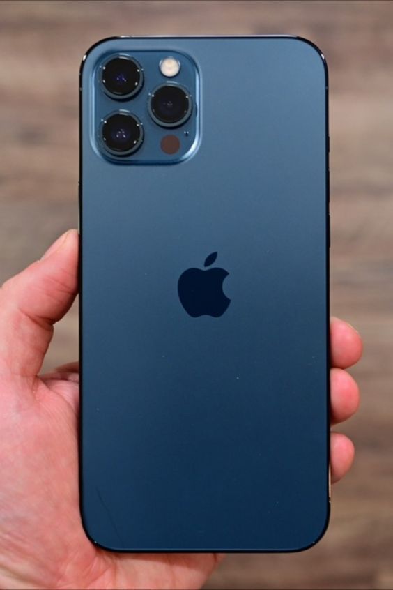 an iphone 11 pro is shown in this hand - held photo, with the back camera facing up