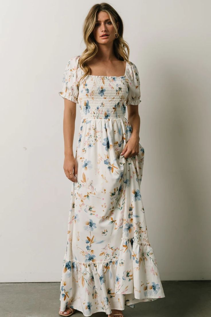 This stunning print maxi dress with effortless flow and smocked bodice has all the hues of a warm, spring day. The tiered skirt mixed with a slight bubble sleeve have us ready for the season change! Season Change, Smocked Maxi Dress, Maxi Dress White, Baltic Born, Warm Spring, Bubble Sleeve, Lined Skirt, Spring Day, Mom Outfits