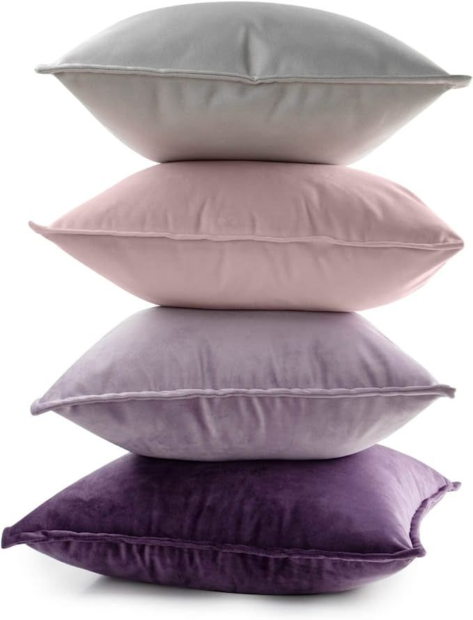 four pillows stacked on top of each other in different colors and sizes, with the same pillow