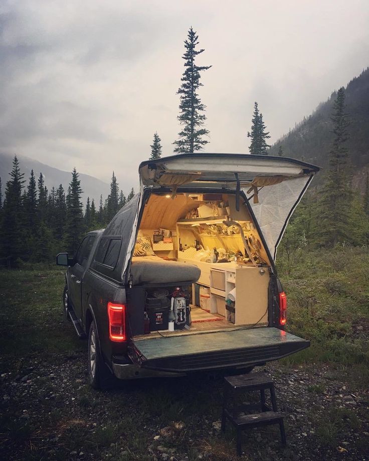 the back end of a van with its doors open and it's cargo compartment opened