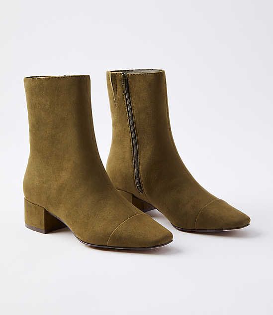 Put some chic in your step with these cap-toed booties, a city-cool staple with polished appeal. Padded footbed for comfort. 1 3/4" heel.,Imported:Imported Loft Cap Toe Booties Size 6 1/2 Olive Women's by Loft Size Regular - 6 1/2 Olive Women's Boots, Footwear Elegant Winter Boots Women, Shoes For Winter 2024, Casual Winter Shoes Women, 2024 Boots Trend, Boots Outfit For Women, Suede Flat Boots, Boots With Jeans, Hipster Clothing, Dressy Boots