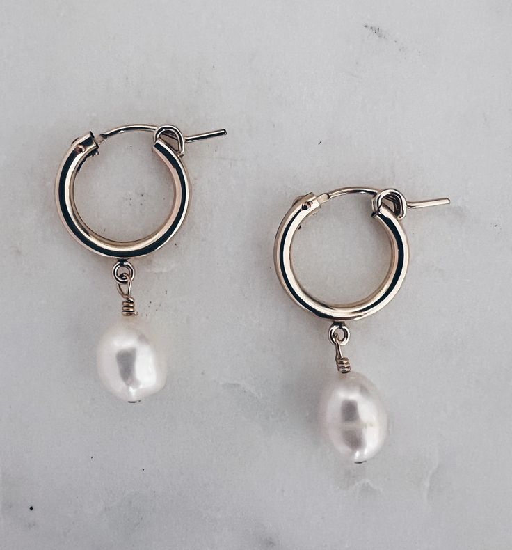 Pretty white & shimmery baroque pearls are hand wired onto 14k gold filled huggie hoops. Hoop is about 14mm and total length is about 1.25 inches. Safe for sensitive skin Tarnish Proof Teardrop Huggie Earrings With Pearl Charm, Everyday Teardrop Huggie Earrings With Pearl Drop, Small Hoop Earrings With Pearl Chain, 14k Gold Filled Hoop Earrings With Pearl Charm, Delicate Pearl Charm Huggie Jewelry, 14k Gold-filled Pearl Drop Huggie Jewelry, 14k Gold Filled Pearl Drop Huggie Jewelry, Delicate Huggie Jewelry With Pearl Charm, 14k Gold-filled Huggie Hoop Earrings With Pearl Charm