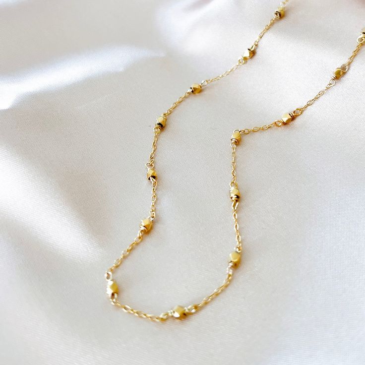 Our signature gold chain. Uniquely designed for layering over any necklace in our collection. Handmade, tarnish resistant 14k gold plated chain. Adjustable between 16"-18". Dainty Charm Necklace With Cable Chain And Oval Link, Delicate Satellite Chain Necklace For Everyday, 14k Gold Filled Chain Link Necklace With Adjustable Chain, Everyday Yellow Gold Chain Link Charm Necklace, Gold 14k Cable Chain Charm Necklaces, Gold 14k Cable Chain Charm Necklace, Gold Charm Necklace With Cable Chain In 14k Gold, 14k Gold-filled Oval Link Necklaces, Yellow Gold Link Chain Charm Necklace