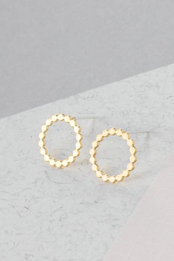 A gorgeous hollow serrated circle that is both delicate and classy. Earring made of high-quality 24k matte gold plating over brass base.A great earring that works well for both daytime and nighttime outfits!Item will arrive in a pretty gift box as shown in last image, ready to give, with my brand logo and a pretty ribbon, just perfect for that special gift!Item is also available in 925 matte silver plating, as seen in image 3. If you would like to purchase this item in silver please proceed with Air Ring, Turquoise Jewelry Set, Circle Stud Earrings, Nature Inspired Rings, Earrings Classic, Jewellery Indian, Minimalist Studs, Sparkly Things, Silver Jewelry Handmade