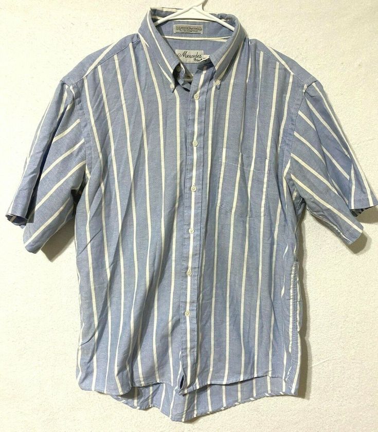 Brand: Mercedes by Enro Color: Blue/White Description: Mens short sleeve button up polo, striped Material Type: 60% combed cotton, 40% polyester Size: 16 1/2 Condition: Gently pre-owned in great condition.  Inventory Number: 20EE Short Sleeve Button Up, Combed Cotton, Men Short Sleeve, Size 16, Casual Button Down Shirt, Mens Short, Blue White, Polo Shirt, Color Blue