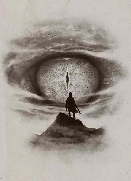 a man standing on top of a hill next to an eye