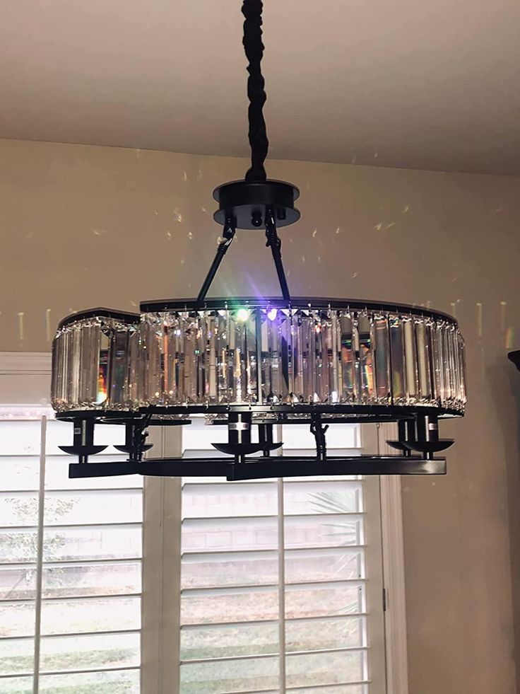 a chandelier hanging from the ceiling in a room