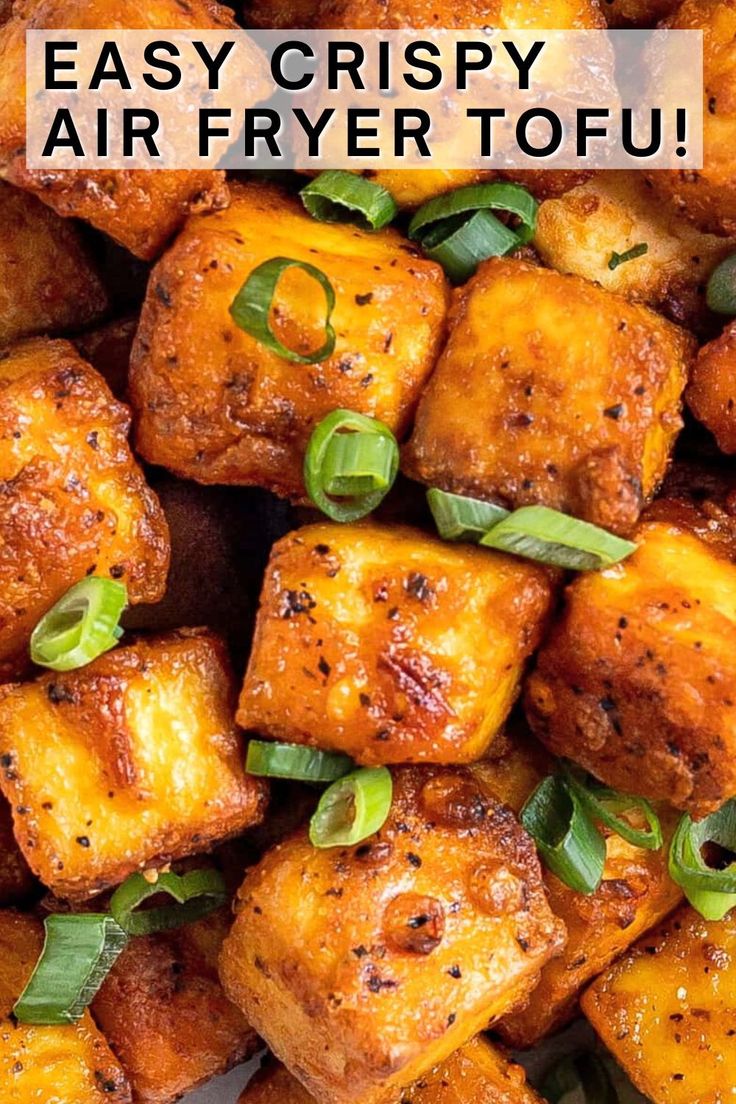 the words easy crispy air fryer tofu are in front of a pile of cube