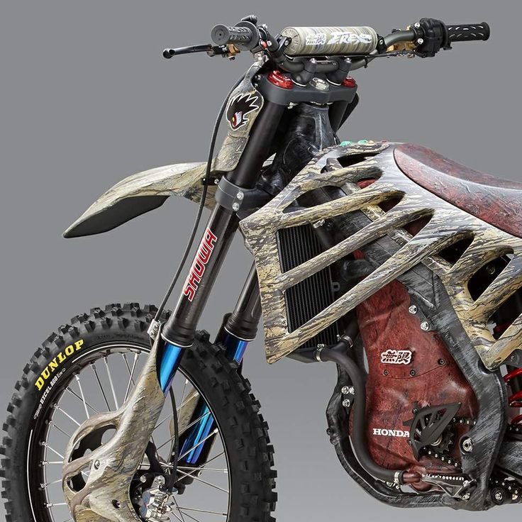 the dirt bike is decorated with wood and paint