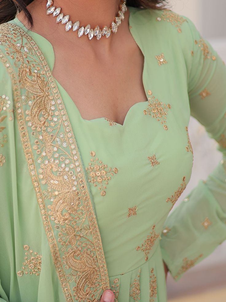 Introducing our stunning "precious pista green sequins georgette engagement wear anarkali gown," the perfect outfit for your special occasions. This exquisite gown comes in a beautiful pista green color with intricate zari embroidery and sequin work, adding a touch of elegance and glamour to your look. The gown is fully stitched and available in sizes ranging from XS to XXL, ensuring a perfect fit for every body type. With a 3.5-meter flair and a length of 56 inches, this gown is sure to make yo Green Embroidered Party Wear Dupatta, Green Chinon Sharara For Party Wear, Green Floor-length Anarkali Set With Mirror Work, Pista Green Chinon Salwar Kameez For Reception, Green Floor-length Anarkali Set With Intricate Embroidery, Green Georgette Anarkali Set With Intricate Embroidery, Green Intricate Embroidery Georgette Anarkali Set, Pista Green Anarkali Dress In Georgette, Party Anarkali Set In Pista Green With Intricate Embroidery