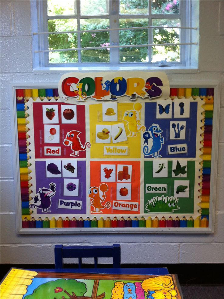 a colorful bulletin board in front of a window with the words colors written on it