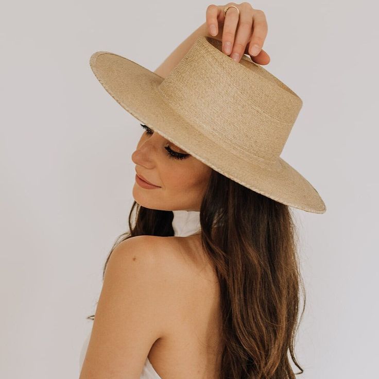 From palm straw to a fashionable work of art, the Huatulco summer hat will make you shine this summer. This is a premium sun hat for the stylish woman with class. The wide rims and high-quality reed give it a premium look. Easily combine this beige summer hat with summer outfits. * Original palm straw from Mexico sourced exclusively from Sahuayo, Michoacán * This palm straw is renowned for its exceptional strength, flexibility, and durability * Meticulously handcrafted by skilled artisans, refle Flat Brim Paper Straw Hat, Elegant Brimmed Straw Hat Made Of Paper Straw, Flat Brim Toquilla Straw Hat For Garden Party, Beach Panama Hat With Flat Crown For Kentucky Derby, Flat Brim Panama Hat For Garden Party, Toquilla Straw Fedora Panama Hat For Garden Party, Flat Crown Panama Hat For Kentucky Derby Beach, Elegant Straw Hat With Flat Crown For Vacation, Elegant Panama Hat With Curved Brim