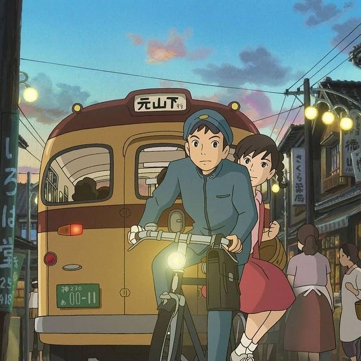 a man riding a bike next to a woman on a street with a bus in the background