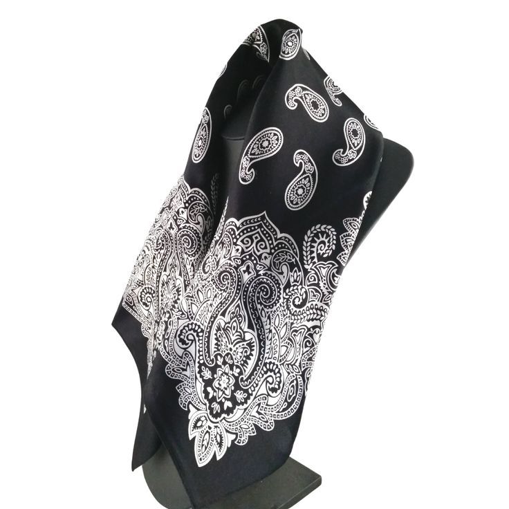 Fenris 100% Silk Bandana A classic bandana, elevated. Wear it any way you would wear a cotton bandana. Color: Black20 inch x 20 inch squareSoft 100% mulberry silk charmeuse Black Silk Scarf As Summer Gift, Black Silk Scarf For Summer Gift, Black Bandana Print Headscarf, Black Bandana Print Headscarf For Summer, Black Bandana Print Gift Bandana, Black Summer Bandana, Black Bohemian Scarves With Bandana Print, Elegant Black Bandana For Summer, Black Bandana With Bandana Print For Festivals