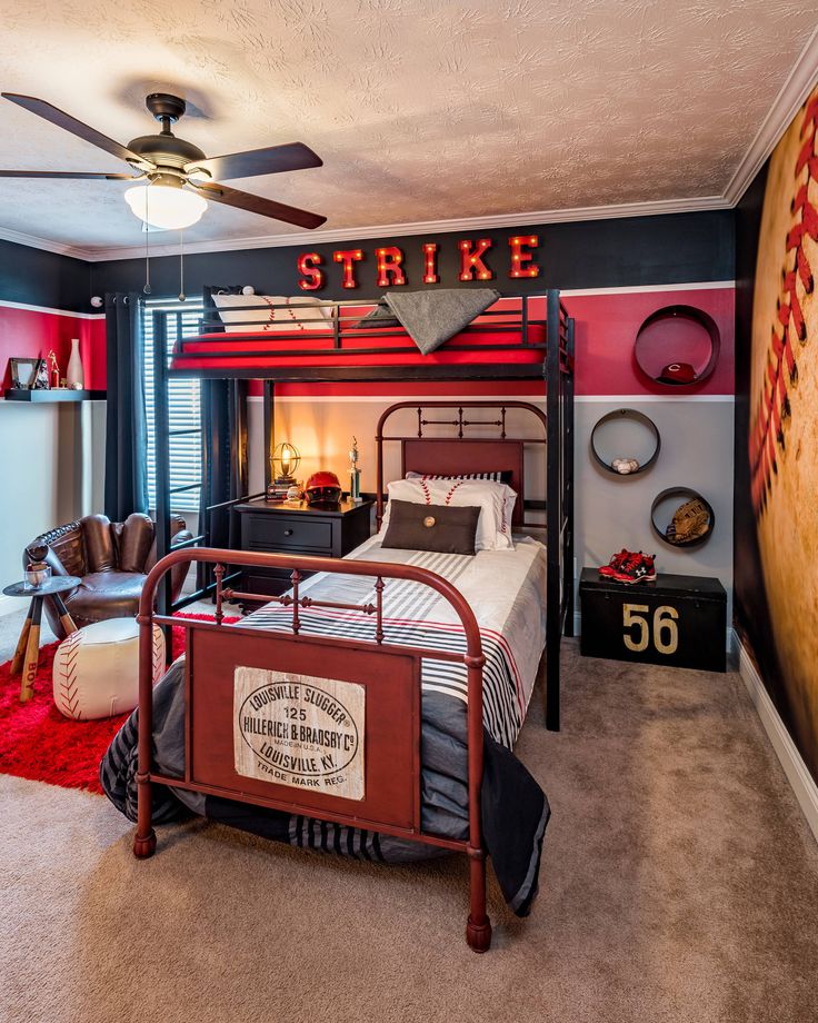 a bedroom with a bunk bed and red walls