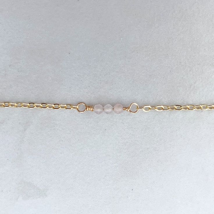 The daintiest adornment for your wrist (or anklet!). Details: - 14k gold-filled cable chain - your choice of round micro-faceted gemstones - round spring clasp Please note: If you do not see your bracelet/anklet size, please reach out to us at info@hellorising.com. We believe everyone deserves to wear pretty jewelry. Gemstones: Clear quartz, known as the stone of power, is believed to be able to amplify energies and protect against negativity. Labradorite, a stone of transformation that can prot Spiritual Rose Quartz Jewelry For Friendship, Minimalist Gemstone Bracelets For Meditation, Adjustable Beaded Bracelet With Delicate Chain For Gift, Dainty Rose Quartz Beaded Bracelets, Minimalist Birthstone Jewelry For Meditation, Minimalist Crystal Bracelet With Natural Stones For Everyday, Dainty Adjustable Anklets As Gift, Dainty Adjustable Anklets For Gift, Dainty Adjustable Anklets For Gifts