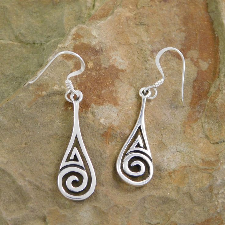 Celtic Spiral earrings, wear your heritage proudly with this dainty pair of earrings. Metal:  .925 Sterling Silver Hallmark:  .925 Face width:  7 mm Drop:  Approx.  37 mm ( 1.45 inches) Earrings are casted by my hubby and hand finished & polished by me So their may be a few very slight imperfections . We started sand casting simple silver pendants over 20 years ago and as we learned started casting more intricate pieces. Over time we got better and  to fund our hobby started selling at flea mark Sterling Silver Swirl Earrings For Gift, Swirl Shaped Sterling Silver Earrings For Gifts, Hypoallergenic Sterling Silver Swirl Earrings, Spiral Sterling Silver Pierced Earrings, Spiral Sterling Silver Earrings For Anniversary, Sterling Silver Spiral Earrings For Anniversary, Sterling Silver Swirl Jewelry With Matching Earrings, Anniversary Spiral Sterling Silver Earrings, Hypoallergenic Spiral Sterling Silver Jewelry