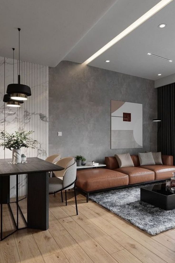 a living room filled with furniture next to a dining table and chairs on top of a hard wood floor