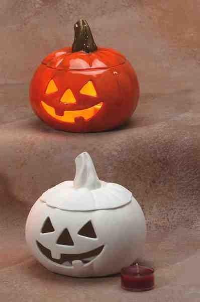 two jack o lantern pumpkins sitting next to each other on the ground with their faces carved into them