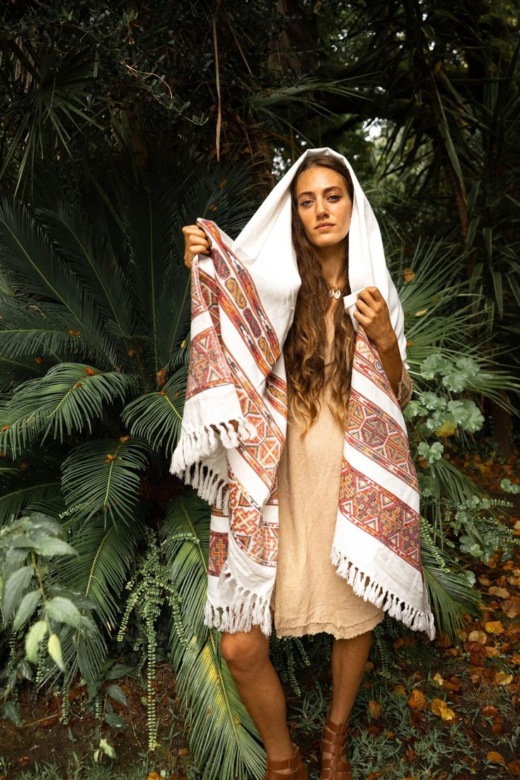 This tribal hippie coverup/scarf is perfect to keep you warm while winter season. The dimensions are 105 x 215 cm. The embroidery process is done by hand and gives this organic ethnic look.  For more similar products visit my shop : https://keralua.etsy.com ༶ ༶ ༶ ༶ ༶ ༶ ༶ ༶ ༶ ༶ ༶ ༶ ༶ ༶ ༶ ༶ ༶ ༶ ༶ ༶ ༶ ༶ ༶ ༶ ༶ ༶ ༶ ༶ ≫ MATERIAL  Mixed fibers / Wool  ༶ ༶ ༶ ༶ ༶ ༶ ༶ ༶ ༶ ༶ ༶ ༶ ༶ ༶ ༶ ༶ ༶ ༶ ༶ ༶ ༶ ༶ ༶ ༶ ༶ ༶ ༶ ༶ ≫ FITTING / CARE  Our product is presented in one size and the dimension is 105 x 215 cm Our orga Boho Shawl, Natural Clothing, Embroidered Scarf, Ladies Poncho, Winter Boho, Ethnic Looks, Warm Blanket, Wool Shawl, Scarf Set