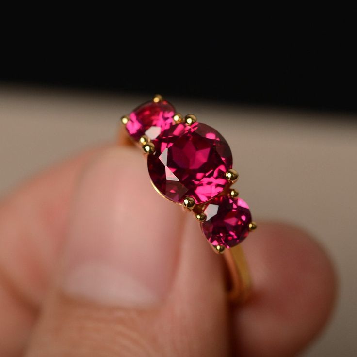 This is a gorgeous handmade creation. Its beauty is its simplicity & Elegance. The 8*8 mm round cut ruby(about 2.60 ct) is crafted in solid sterling silver or 14k white/rose/yellow gold All item is sent in a beautiful gift box If you have any idea of design your ring,pls contact me directly. You can realize more lovely stuff clicking the link https://www.etsy.com/shop/knightjewelry?refshopsection_shophome_leftnav Please leave the correct address and you phone number for delivering successful Formal Ruby Cluster Ring, Red Ruby Ring With Prong Setting, Formal Ruby Birthstone Ring, Yellow Gold Ruby Ring With Round Cut Lab-created Ruby, Ruby Rings With Accent Stones And Round Band, Ruby Rings With Accent Stones In Round Band, Fine Jewelry Garnet Birthstone Ring, Ruby Rings With Round Cut And Prong Setting, Red Ruby Ring With Round Stone