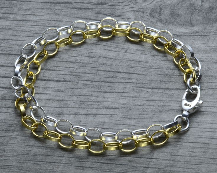 A layered mixed metal dual chain version of our classic sterling silver rolo link charm bracelet! One chain is yellow gold vermeil, and the other is sterling silver. The chains and closure are made in Italy, for an absolutely stunning piece. So shiny and classy! The double strand chain look amazing together and make a nice a statement. Finish on the yellow gold chain is 18k yellow gold vermeil and base material is 100% solid 925 sterling silver. The vermeil gold finish is 5 times thicker than re Rolo Chain Link Charm Bracelet As Gift, Gold Sterling Silver Cable Chain Bracelet, Gold Sterling Silver Bracelet With Cable Chain, Gold Sterling Silver Chain Link Bracelet, Bracelet Thick, Charm Bracelets For Girls, Sterling Silver Charm Necklace, Cleaning House, Long Pearl Necklaces