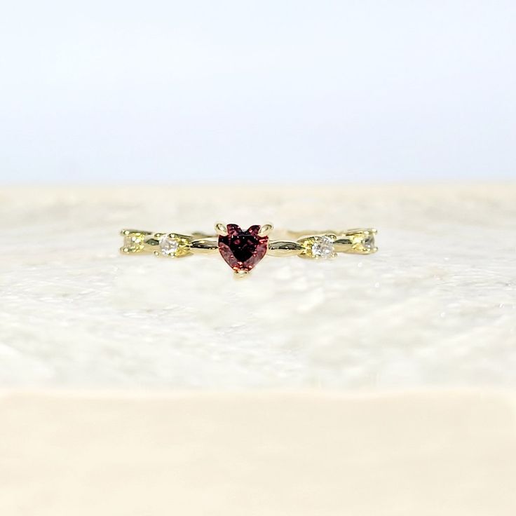 Petite 18k Yellow Gold Heart Shaped Ruby July Birthstone Delicate Dainty Ring Size 7 18k Yellow Gold Plated This Ring Is True To Its Beauty!!! The Detail And Sheer Sparkle Is Absolutely Stunning!! Wear Your Heart On Your Finger, Or Gift This To The Love Of Your Life! This Heart Shaped Solitaire Gemstone Sits Pretty On A 18k Yellow Gold Plated Band. This Lab Created Ruby Is A Shiny Red Gem Teeming With Fire And Brilliance. #Goldplated #Ringsize7 #Size7ring #Julybirthstone #Ruby Red Fashion Gold P Gold Ruby Ring For Valentine's Day, Heart-shaped 14k Gold Birthstone Ring, Stackable Cubic Zirconia Jewelry For Valentine's Day, Valentine's Day Stackable Cubic Zirconia Jewelry, Valentine's Day Gold Ruby Ring, Yellow Gold Heart-shaped Ruby Ring, Heart-shaped Yellow Gold Ruby Ring, Yellow Gold Ruby Ring For Valentine's Day Promise, Heart-shaped Yellow Gold Birthstone Ring