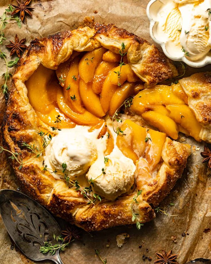 a pie topped with peaches and whipped cream