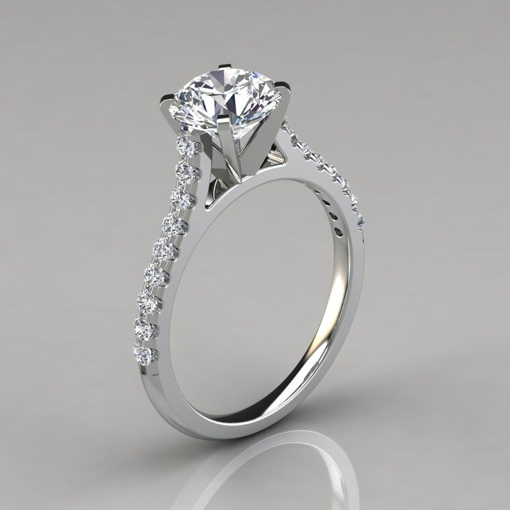 a white gold engagement ring with diamonds on the side