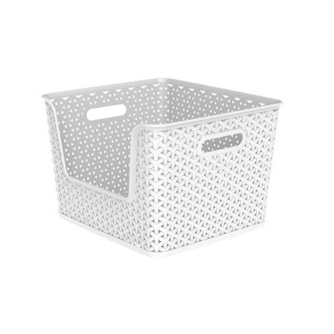 a white basket with dots on it