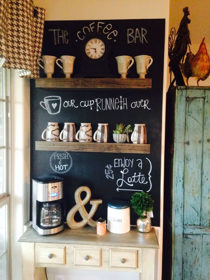 there is a chalkboard on the wall with coffee cups and other things in it