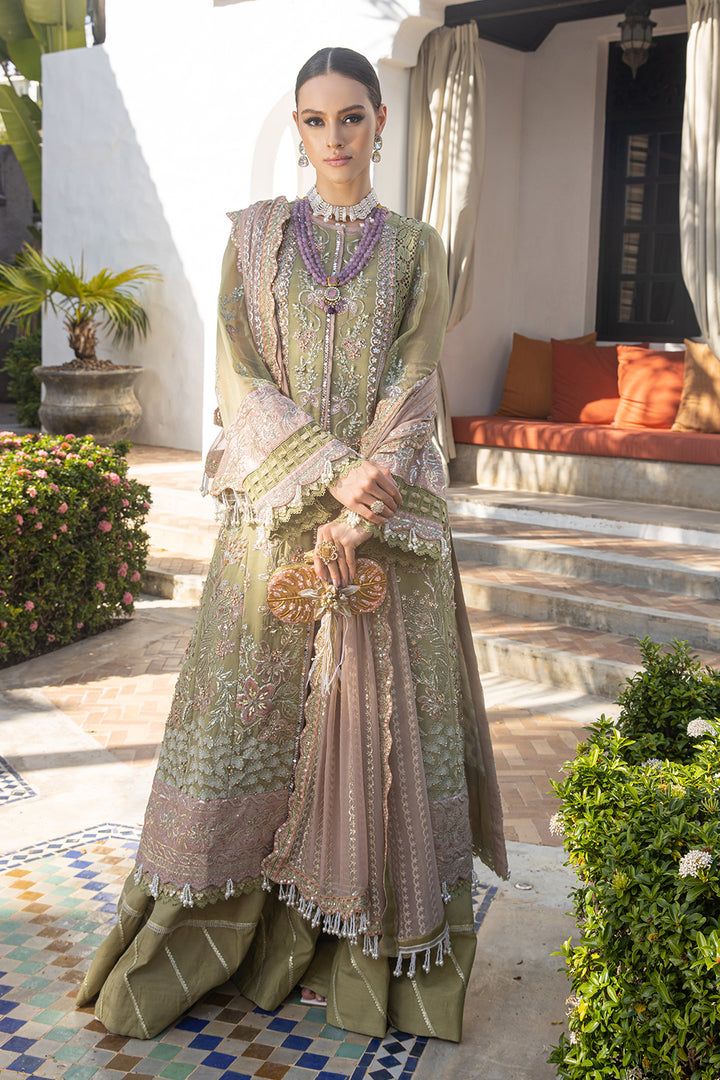 Mendi Green Embellished Kameez Sharara Pakistani Wedding Dress is a beautiful masterpiece adorned with hand-crafted embellishments. Zardosi, sequins, and pearls give a glamorous touch to this perfectly stitched Gharara Dress, making it an epitome of beauty and grace. Organza Kameez: The kameez comes in premium organza fabric and it has a beautiful pink color. Hand-crafted details of dabka, zardosi, and pearls give a traditional look to this green kameez. Shimmering sequins and metallic threads g Party Wear Lawn Suit For Eid Reception, Organza Lawn Suit With Intricate Embroidery For Reception, Hand Embellished Party Gown For Eid, Party Wear Salwar Kameez With Hand Embellished Traditional Drape, Embellished Salwar Kameez For Wedding Party, Hand Embellished Party Wear Lehenga For Eid, Hand Embellished Salwar Kameez For Eid, Embellished Semi-stitched Lawn Suit For Eid, Hand Embellished Semi-stitched Traditional Party Wear