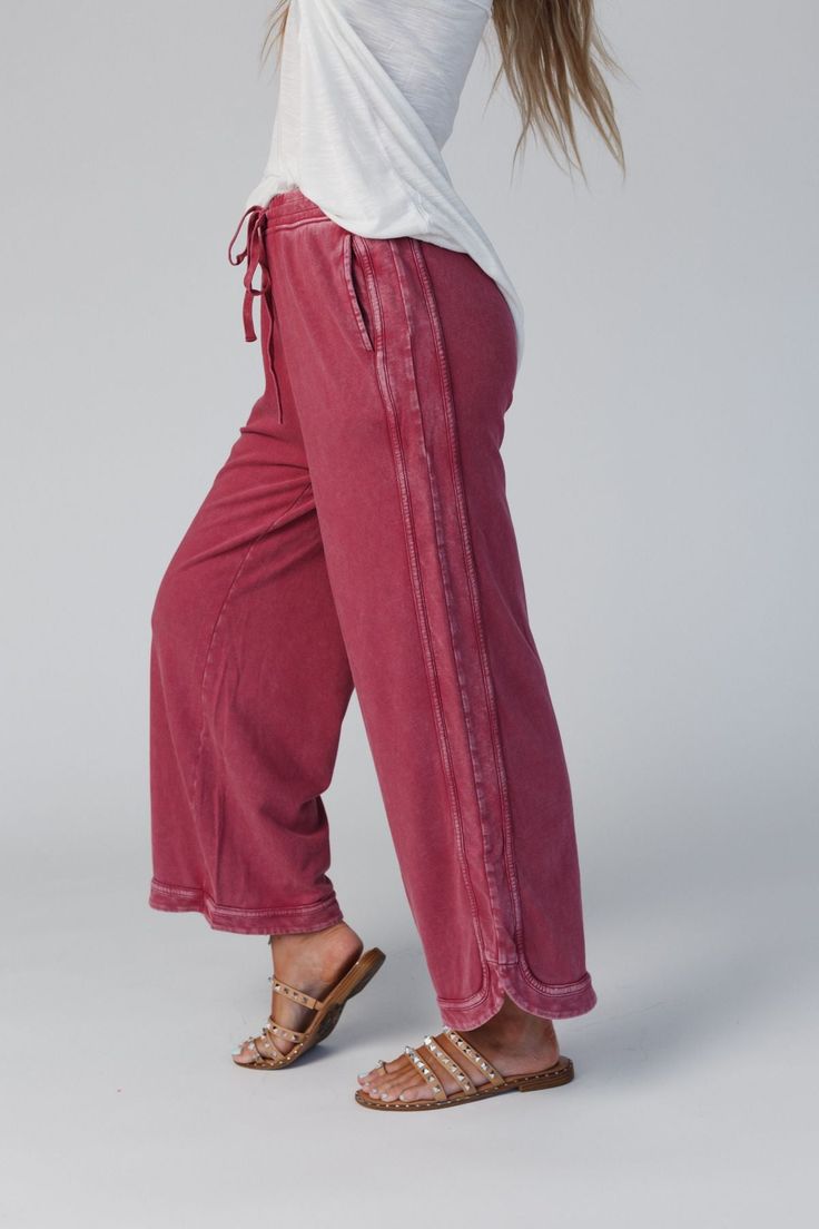 Comfy and cozy all in one! Our lounge pant features a wide leg, drawstring waist and pockets (yay!). It will be your closet fave to pair with graphic tees for lounging or on-the-go outfits! *Due to lighting and differences in monitors, actual colors may vary slightly from what appears online. Model is 5'8" and wearing size Small Approximate measurements are as follows: SMALL: Waist: 26", Inseam: 26 1/2", Length: 34" MEDIUM: Waist: 28", Inseam: 27", Length: 34 1/2" LARGE: Waist: 30", Inseam: 27 1 Side Pants, Wide Leg Palazzo Pants, Ruffle Pants, Short Sleeve Jumpsuits, Knit Jumpsuit, Wide Leg Cropped Pants, Flowy Pants, Comfy Pants, Pants Large